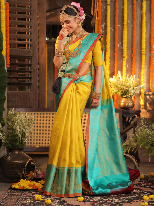 Nimbaka  -  Lemon yellow silk with floral zari and traditional pallu