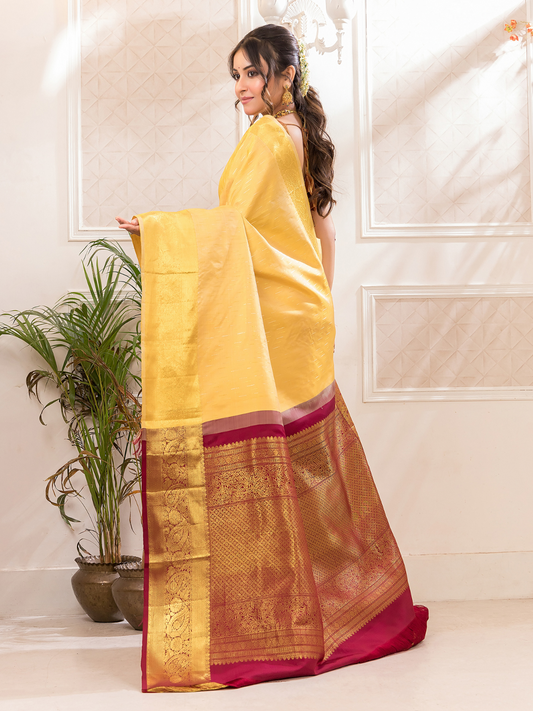 Swarna  -  Ivory silk with golden floral vine and temple border