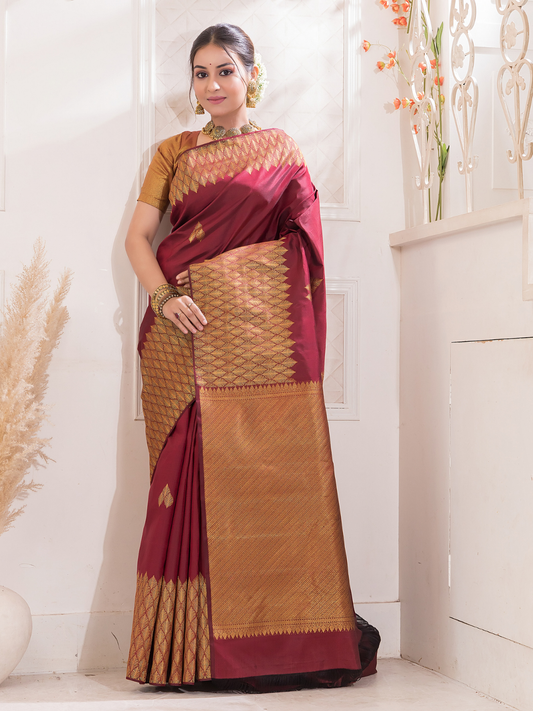 Manjari  -  Ruby red silk with intricate golden zari and festive tone