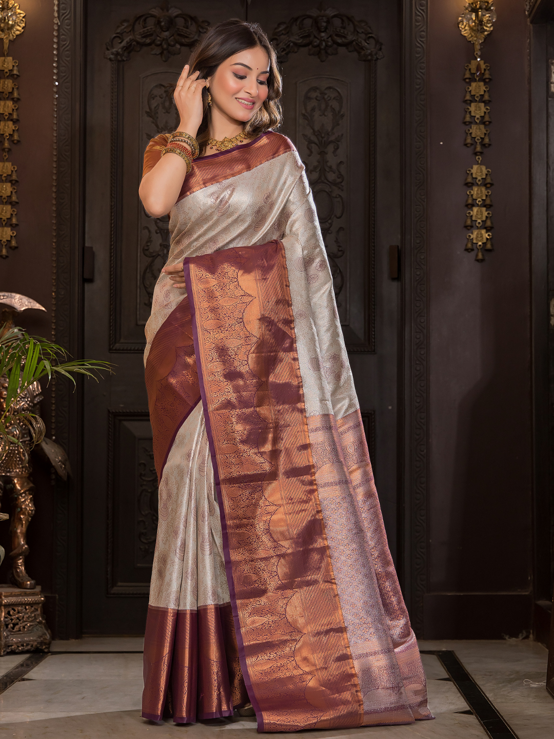 Shaivalya  -  Thyme green silk with contrasting zari lotus border