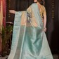 Varnitha - Earth-toned tan silk with sapphire blue zari edge
