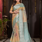 Varnitha - Earth-toned tan silk with sapphire blue zari edge