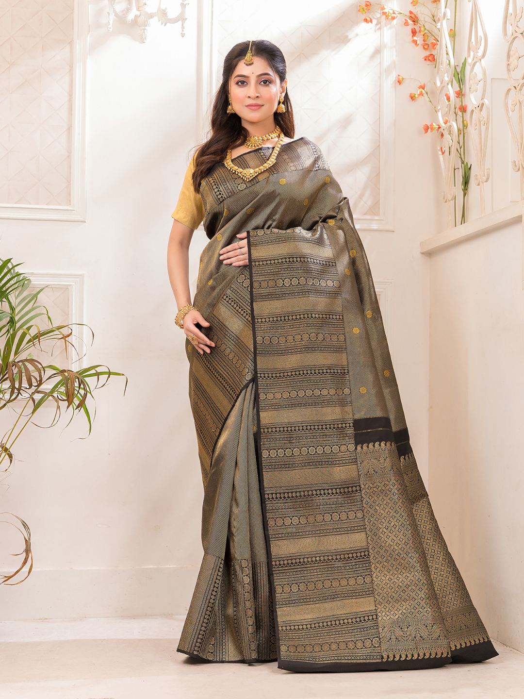 Hemapatra - Golden khaki green saree with vine motifs and Zari