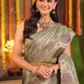 Harini Vastra - Golden Jade green silk with peacock buttas and zari elegance