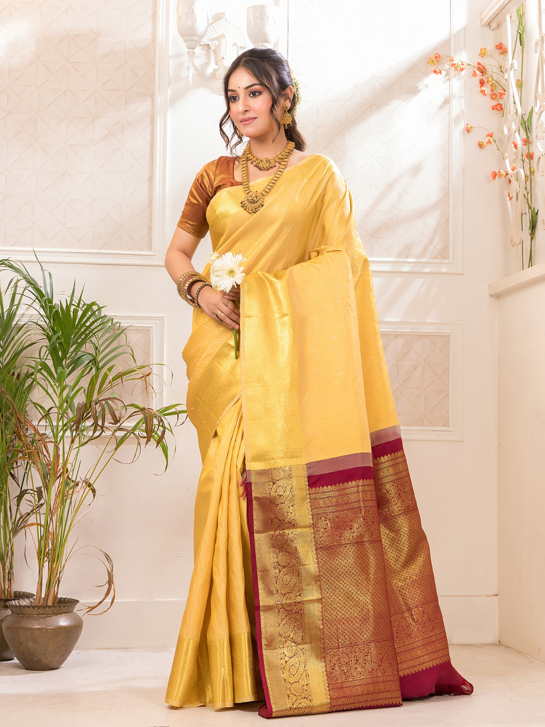 Swarna  -  Ivory silk with golden floral vine and temple border