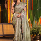 Harini Vastra - Golden Jade green silk with peacock buttas and zari elegance