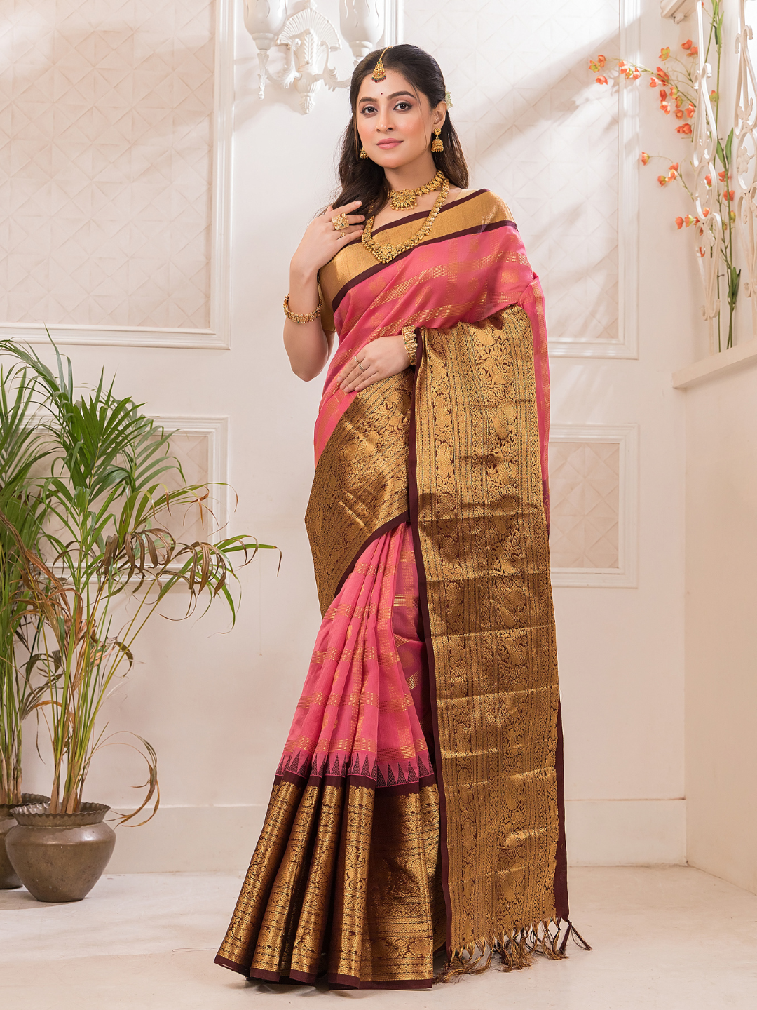 Swarna  -  Ivory silk with golden floral vine and temple border