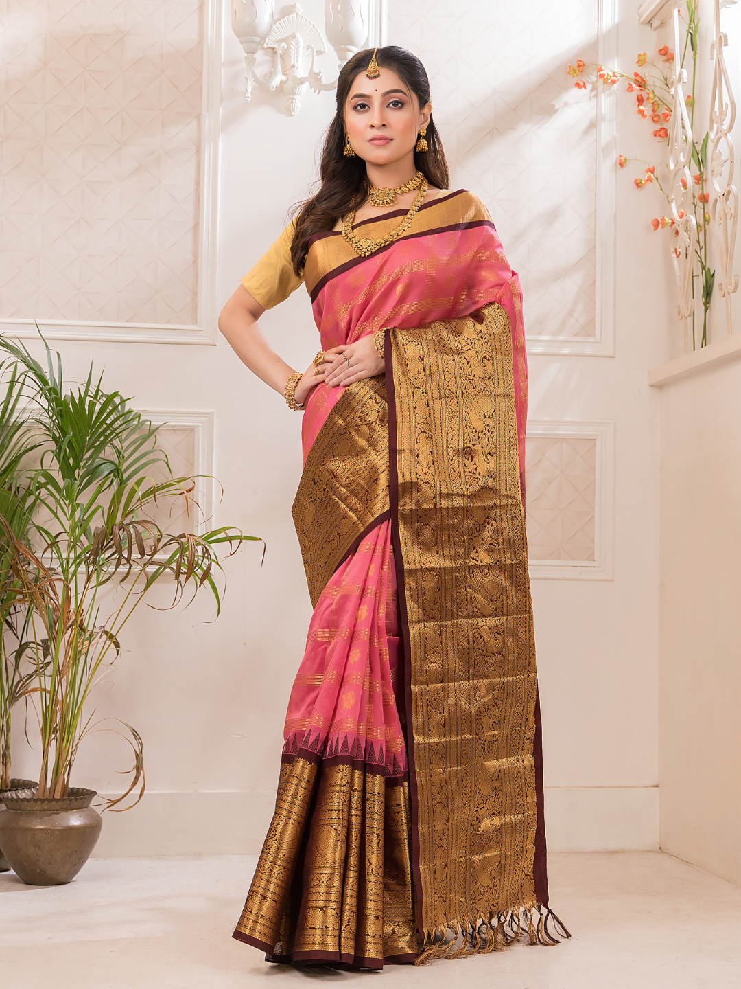 Swarna  -  Ivory silk with golden floral vine and temple border