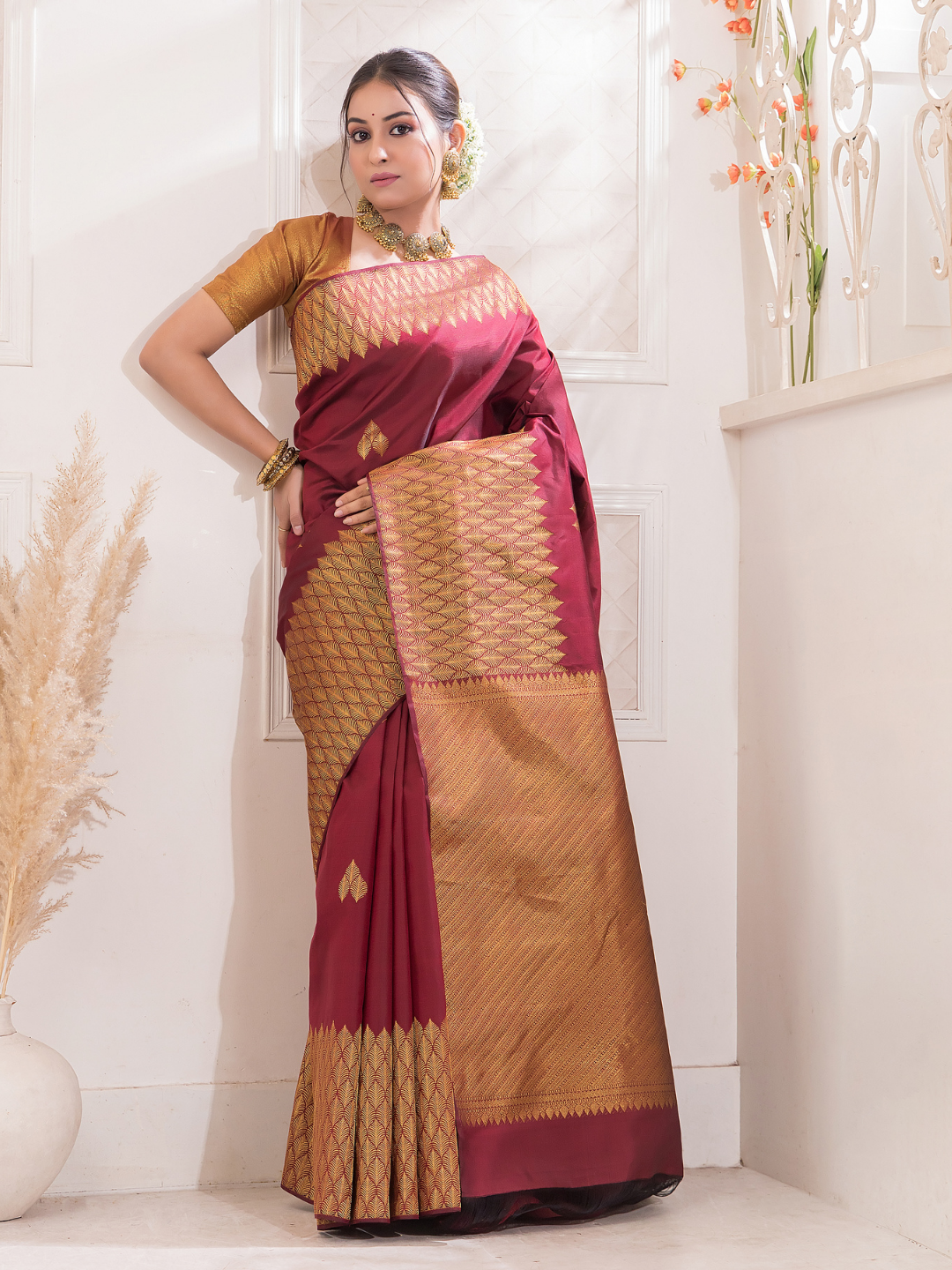 Manjari  -  Ruby red silk with intricate golden zari and festive tone